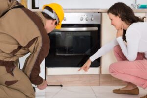 1-126963486_m-1 (5) (1) guy spraying deck with water. needs pest control instead.