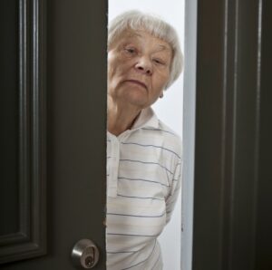 guy spraying deck with water. needs pest control instead.